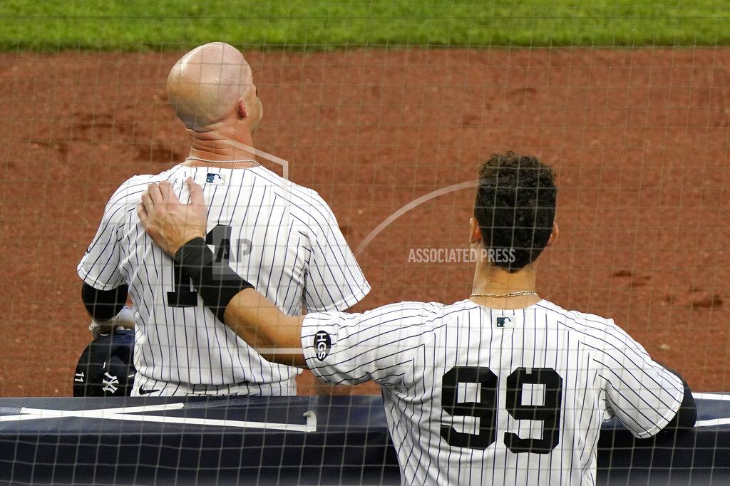 Kathy Willens New York Yankees Aaron Judge (99) puts his arm on Brett Gardner's back as Gardner takes a break during a pitching change in the ninth inning of a baseball game Miami Marlins, Sunday, Sept. 27, 2020, at Yankee Stadium in New York. (AP Photo/Kathy Willens)