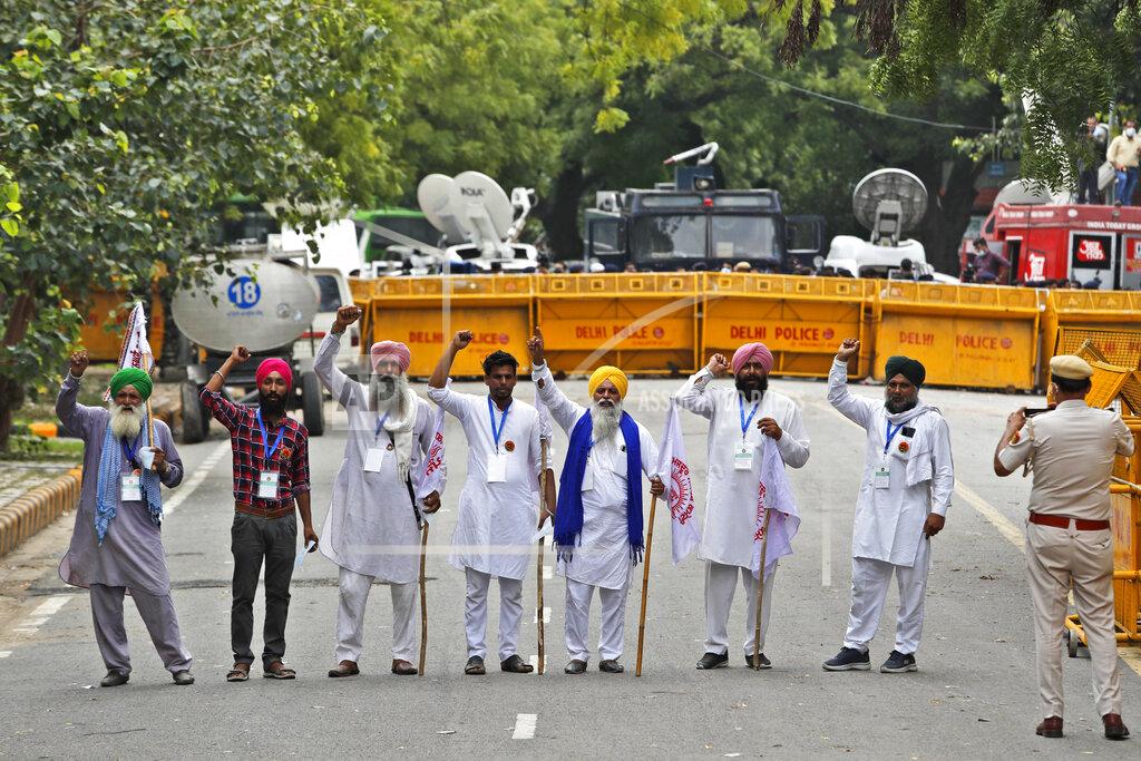 Manish Swarup Farmers shout anti government slogans during a protest in New Delhi, India, Thursday, July 22, 2021. More than 200 farmers on Thursday began a protest near India's Parliament to mark eight months of their agitation against new agricultural laws that they say will devastate their income. (AP Photo/Manish Swarup)