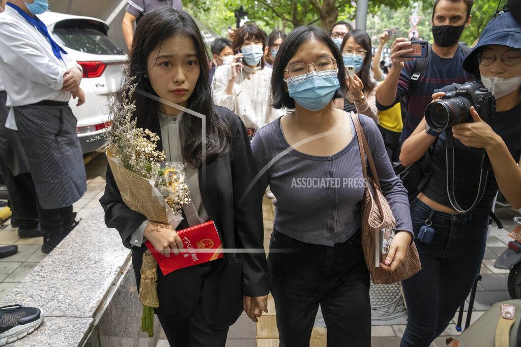 Mark Schiefelbein Zhou Xiaoxuan, left, a former intern at China's state broadcaster CCTV, arrives to attend a court session at a courthouse in Beijing, Tuesday, Sept. 14, 2021. Zhou became the face of the country's MeToo movement after going public with accusations against a prominent CCTV host in 2018. Since then, even as the movement was shut down by authorities, Zhou has continued to speak out. (AP Photo/Mark Schiefelbein)