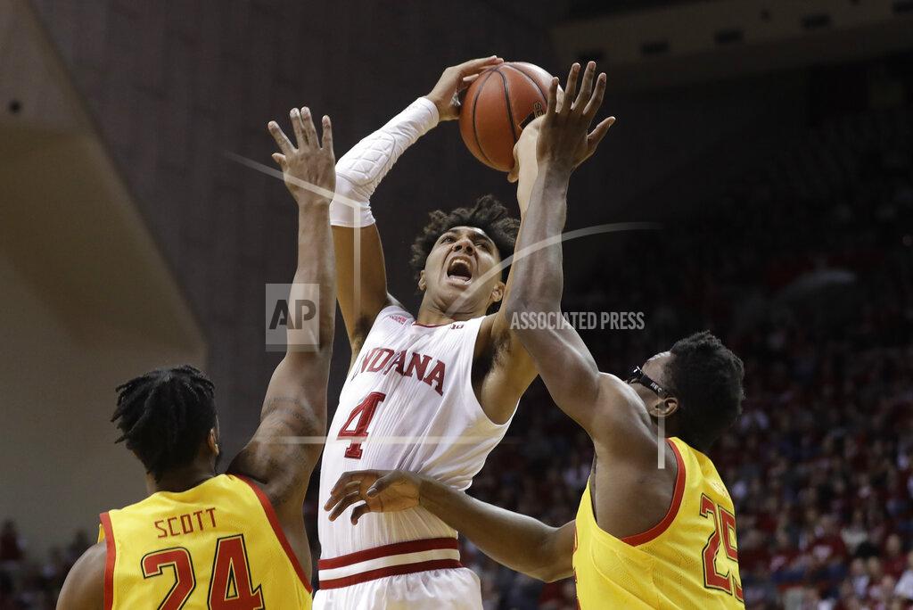 Darron Cummings Indiana's Trayce Jackson-Davis (4) shoots over Maryland's Donta Scott (24) and Jalen Smith (25) during the first half of an NCAA college basketball game, Sunday, Jan. 26, 2020, in Bloomington, Ind. (AP Photo/Darron Cummings)