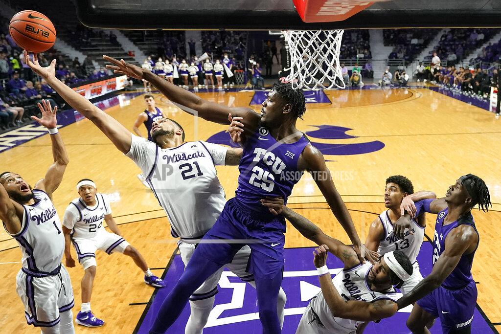 Charlie Riedel Kansas State forward Davion Bradford (21) battles TCU center Souleymane Doumbia (25) for a rebound during the second half of an NCAA college basketball game Wednesday, Jan. 12, 2022, in Manhattan, Kan. TCU won 60-57. (AP Photo/Charlie Riedel)