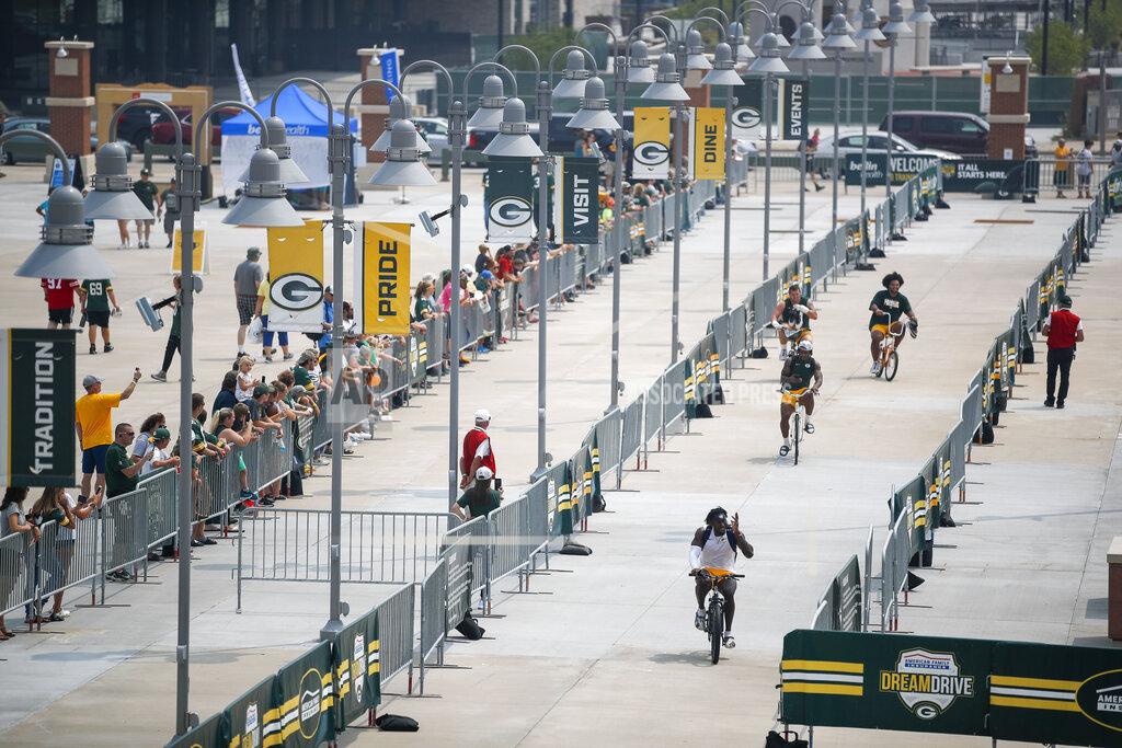 Matt Ludtke Green Bay Packers players make their way back from the practice field to Lambeau Field at the conclusion of NFL football training camp Saturday, July 31, 2021, in Green Bay, Wis. (AP Photo/Matt Ludtke)