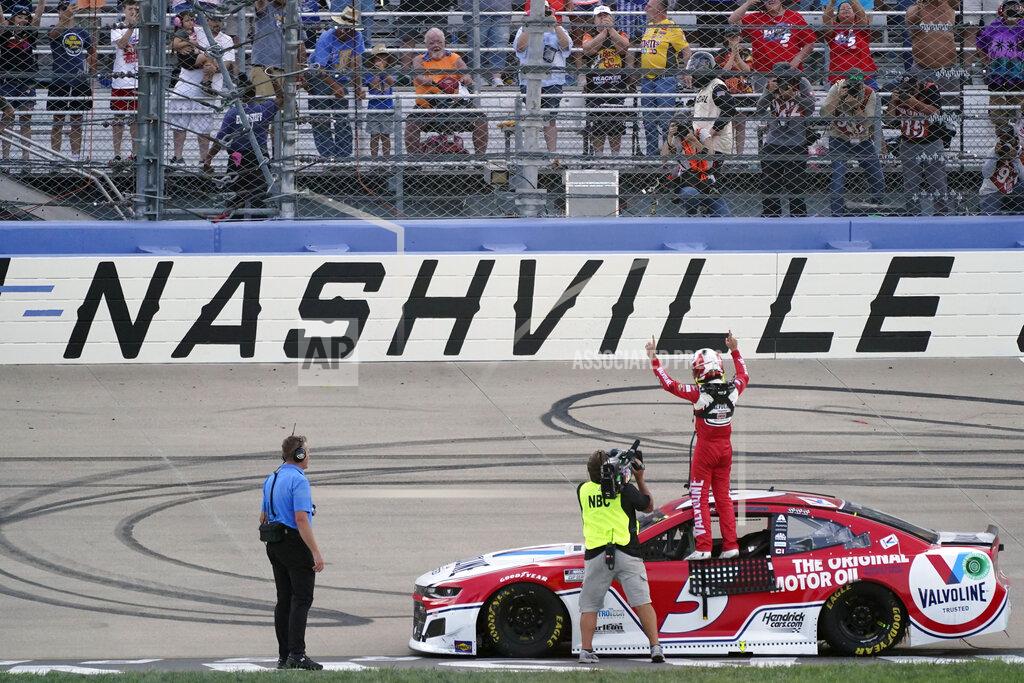 Mark Humphrey Kyle Larson celebrates after winning a NASCAR Cup Series auto race at Nashville Superspeedway Sunday, June 20, 2021, in Lebanon, Tenn. (AP Photo/Mark Humphrey)