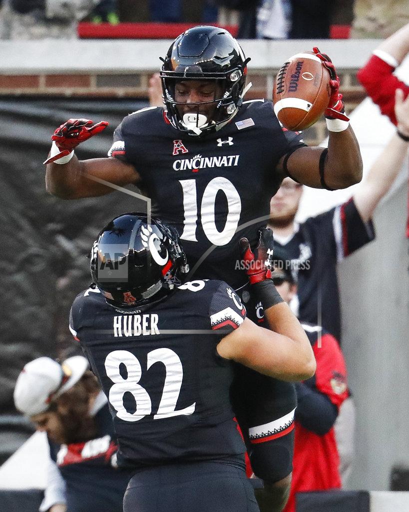 John Minchillo Cincinnati running back Charles McClelland (10) celebrates his touchdown with tight end Wilson Huber (82) in the second half of an NCAA college football game against Navy, Saturday, Nov. 3, 2018, in Cincinnati. (AP Photo/John Minchillo)