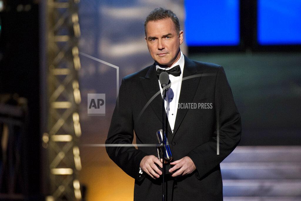 Charles Sykes FILE - Comedian-actor Norm Macdonald appears onstage at The 2012 Comedy Awards in New York on April 28, 2012. Macdonald, a comedian and former cast member on "Saturday Night Live," died Tuesday, Sept. 14, 2021, after a nine-year battle with cancer that he kept private, according to Brillstein Entertainment Partners, his management firm in Los Angeles. He was 61. (AP Photo/Charles Sykes, File)