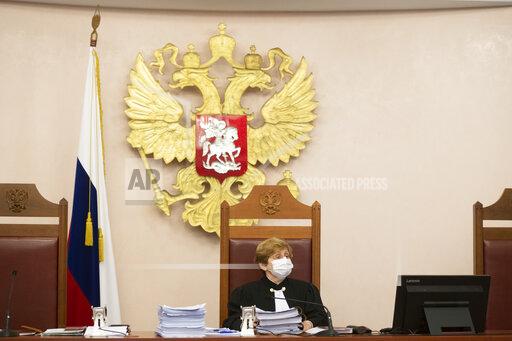Judge Alla Nazarova attends a hearing in the Supreme Court of the Russian Federation in Moscow, Russia, Thursday, Nov. 25, 2021. The Prosecutor General's Office earlier this month petitioned the Supreme Court to revoke the legal status of Memorial - an international human rights group that rose to prominence for its studies of political repressions in the Soviet Union. The move sparked much public outrage and is part of a months-long crackdown on dissent. (AP Photo/Dmitry Serebryakov)