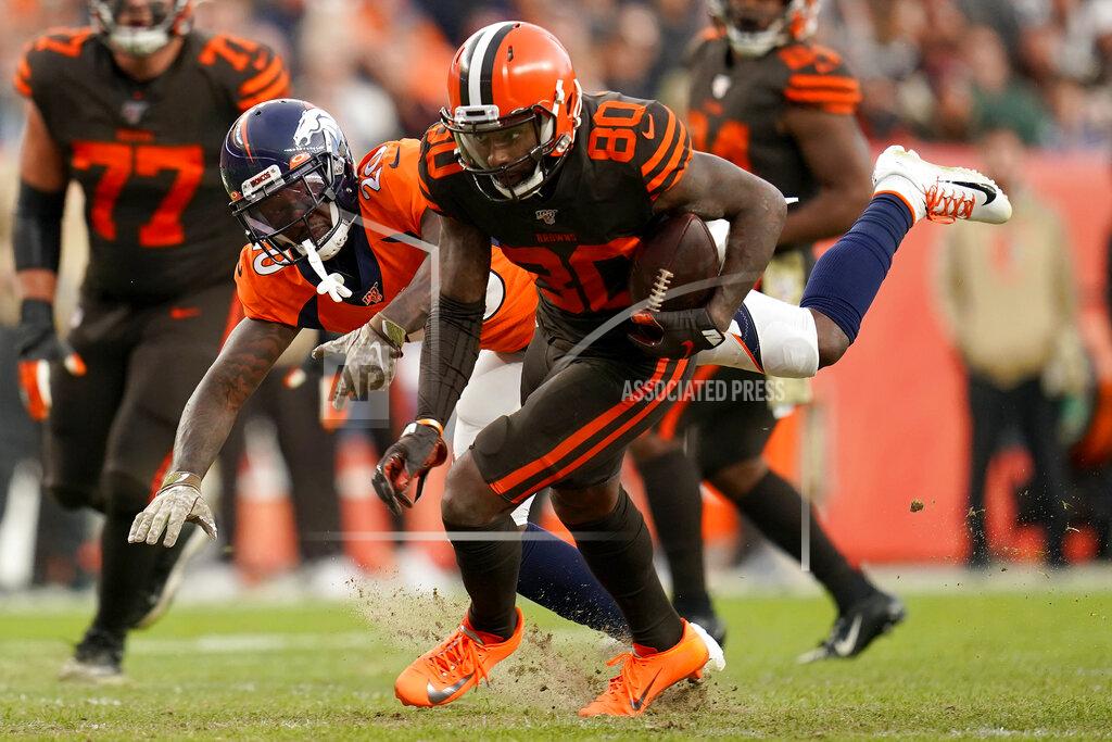 Jack Dempsey Cleveland Browns wide receiver Jarvis Landry (80) eludes Denver Broncos defensive back Duke Dawson (20) during the second half of NFL football game, Sunday, Nov. 3, 2019, in Denver. (AP Photo/Jack Dempsey)