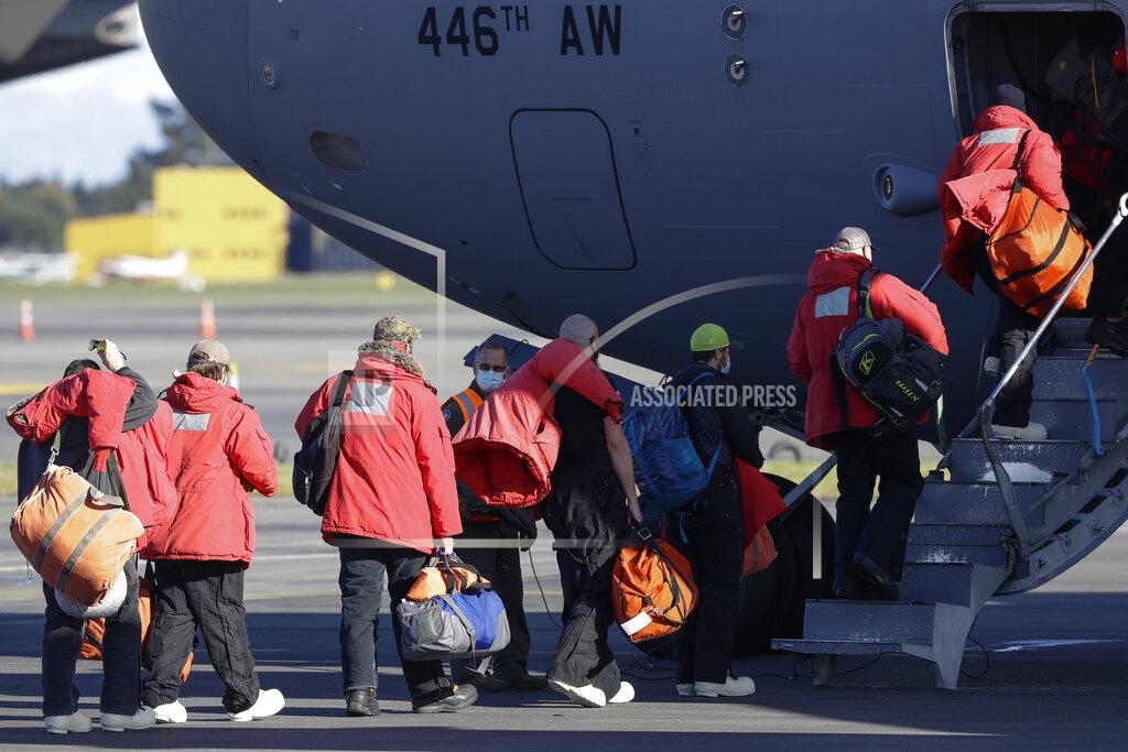 Mark Baker Staff board a U.S. Air Force C-17 as they prepare to take the season's first flight to McMurdo Station in Antarctica from Christchurch Airport, New Zealand, Monday, Sept. 14, 2020. The first U.S. flight into Antarctica following months of winter darkness left from New Zealand Monday with crews extra vigilant about keeping out the coronavirus. (AP Photo/Mark Baker)