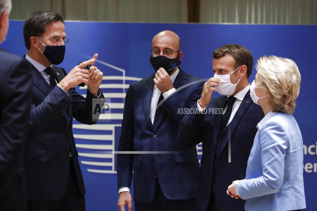 Stephanie Lecocq From left, Dutch Prime Minister Mark Rutte, European Council President Charles Michel, French President Emmanuel Macron and European Commission President Ursula von der Leyen attend a round table meeting at an EU summit in Brussels, Tuesday, July 21, 2020. Weary European Union leaders finally clinched an unprecedented budget and coronavirus recovery fund early Tuesday, finding unity after four days and as many nights of fighting and wrangling over money and power in one of their longest summits ever. (Stephanie Lecocq, Pool Photo via AP)