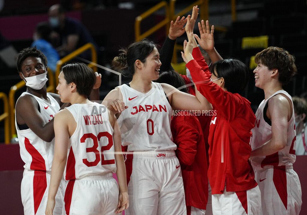 Eric Gay Japan players celebrate their win in the women's basketball preliminary round game against France at the 2020 Summer Olympics, Tuesday, July 27, 2021, in Saitama, Japan. (AP Photo/Eric Gay)