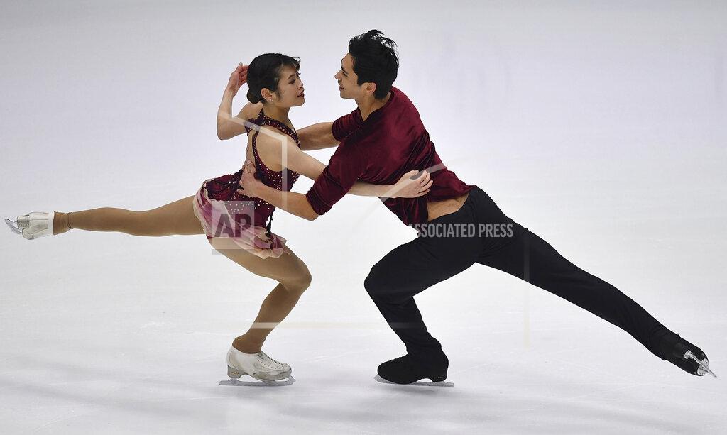 Sergei Stepanov Emily Chan and Spencer Akira Howe of USA perform in the pair's free skating program during the ISU Four Continents Figure Skating Championships in Tallinn, Estonia, Saturday, Jan. 22, 2022. (AP Photo/Sergei Stepanov)