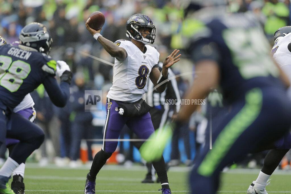 John Froschauer Baltimore Ravens quarterback Lamar Jackson (8) passes against the Seattle Seahawks during the first half of an NFL football game, Sunday, Oct. 20, 2019, in Seattle. (AP Photo/John Froschauer)