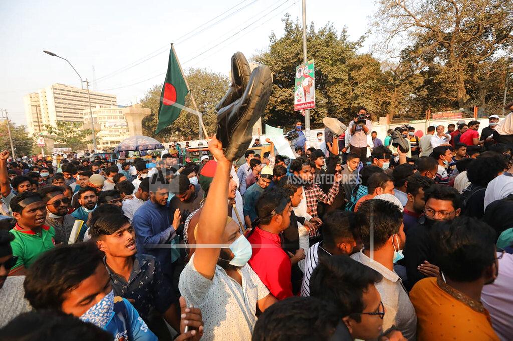 Mahmud Hossain Opu Protesters shout slogans as they protest the death in prison of a writer who was arrested on charges of violating the sweeping digital security, in Dhaka, Bangladesh, Friday, Feb. 26, 2021. Mushtaq Ahmed, 53, was arrested in Dhaka in May last year for making comments on social media that criticized the Prime Minister Sheikh Hasina government's handling of the coronavirus pandemic. He had been denied bail at least six times. (AP Photo/Mahmud Hossain Opu)