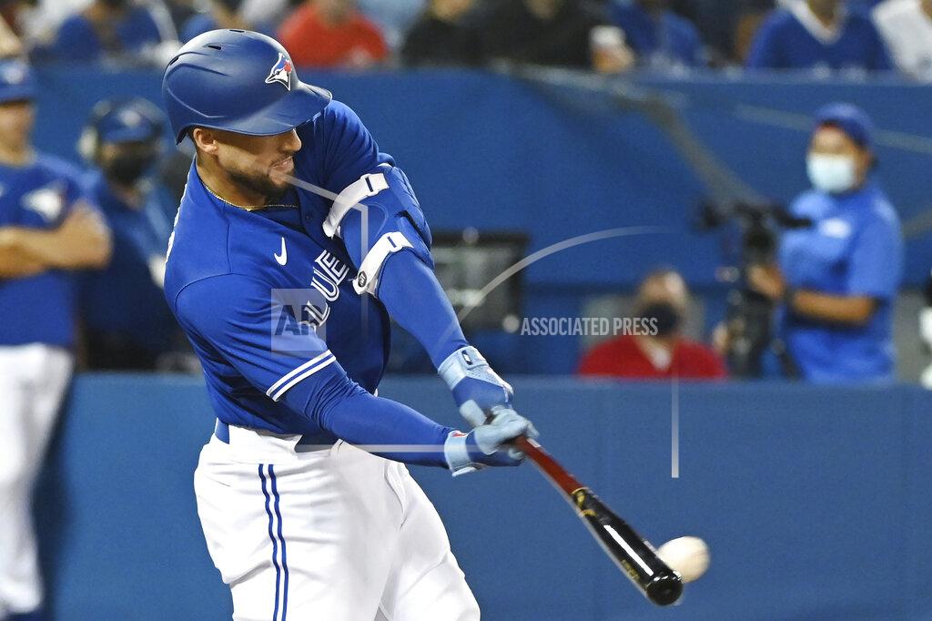 Jon Blacker Toronto Blue Jays' George Springer hits a double against the Tampa Bay Rays during the fourth inning of a baseball game Tuesday, Sept. 14, 2021, in Toronto. (Jon Blacker/The Canadian Press via AP)