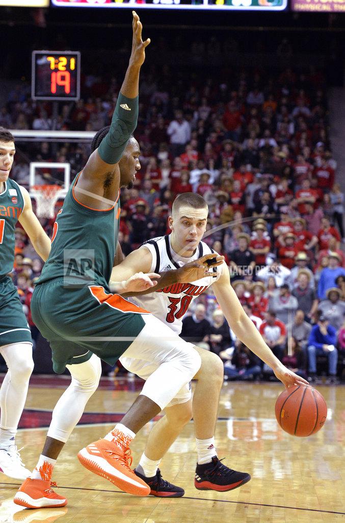 Timothy D. Easley Louisville guard Ryan McMahon (30) attempts to get past the defense of Miami center Ebuka Izundu (15) during the second half of an NCAA college basketball game in Louisville, Ky., Sunday, Jan. 6, 2019. Louisville won 90-73. (AP Photo/Timothy D. Easley)
