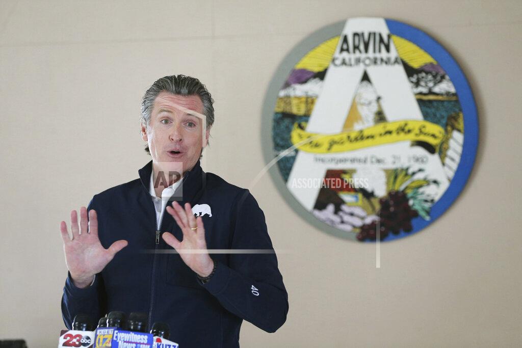 Alex Horvath Californian Governor Gavin Newsom talks during a visit to Arvin Veterans Hall in Arvin, Calif. in Kern County on Monday, Feb. 22, 2021, to highlight the state's efforts to administer COVID-19 vaccines quickly and equitably across California. Newsom said more vaccines are headed to California's vast Central Valley, an agricultural region that has been hard hit by the coronavirus. (Alex Horvath/Bakersfield Californian via AP)