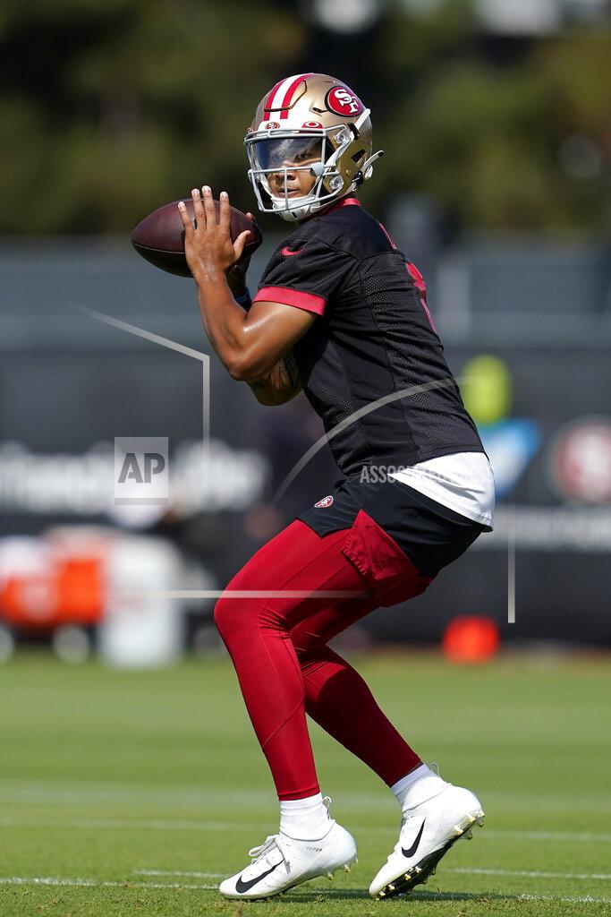 Jeff Chiu San Francisco 49ers quarterback Trey Lance throws a pass at NFL football training camp in Santa Clara, Calif., Wednesday, July 28, 2021. (AP Photo/Jeff Chiu)