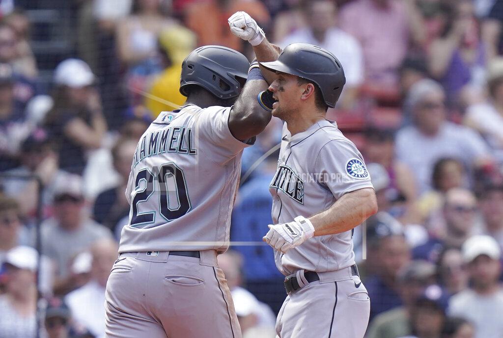 Steven Senne Seattle Mariners' Taylor Trammell, left, celebrates with Adam Frazier, right, after Frazier hit a two-run home run allowing them both to score in the sixth inning of a baseball game against the Boston Red Sox, Sunday, May 22, 2022, in Boston. (AP Photo/Steven Senne)