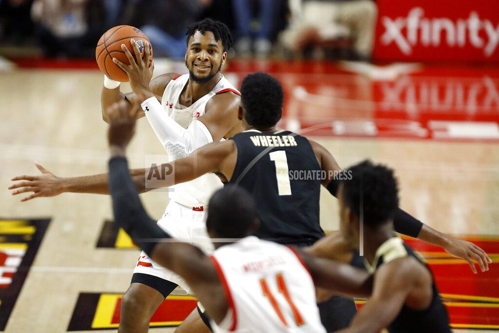 Julio Cortez Maryland forward Donta Scott, top, looks for an open teammate against Purdue during the first half of an NCAA college basketball game, Saturday, Jan. 18, 2020, in College Park, Md. (AP Photo/Julio Cortez)