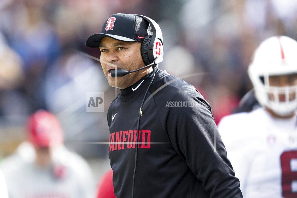 FILE - In this Dec. 1, 2018, file photo, Stanford coach David Shaw watches during the team's NCAA college football game against California in Berkeley, Calif. The Pac-12 has discussed the possibility of moving to an 11-game, all-conference schedule this year amid the unprecedented uncertainty of the coronavirus pandemic, Southern California's Clay Helton says. Shaw also says he doesn't necessarily agree with NCAA President Mark Emmert's belief that college campuses should be open for college sports to resume. (AP Photo/John Hefti, File)