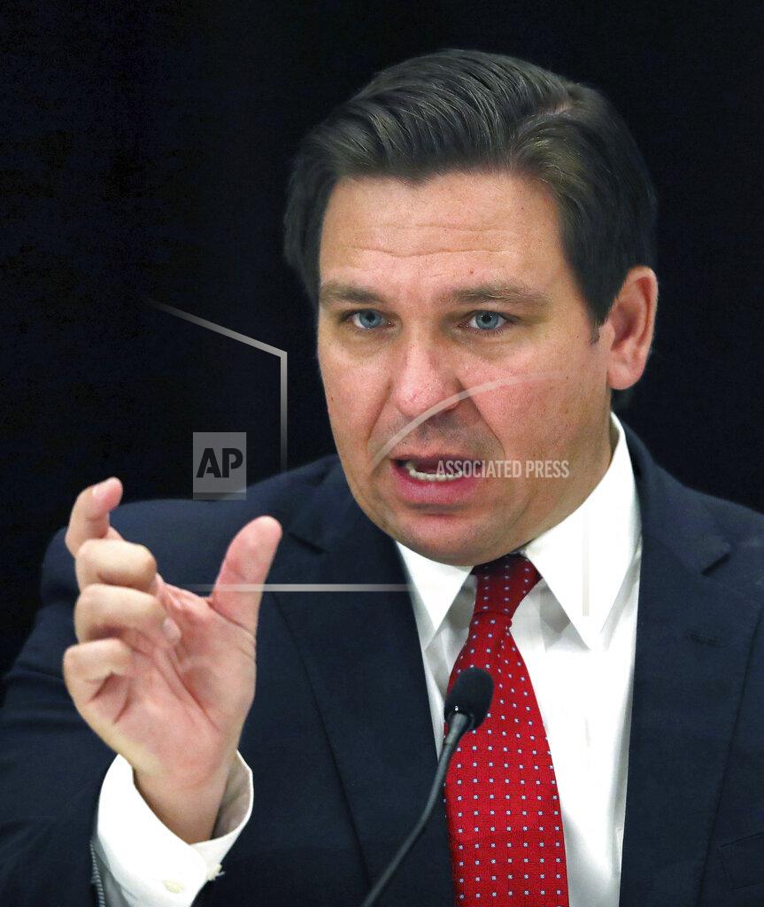 Joe Burbank Florida Gov. Ron DeSantis answers a question during a roundtable meeting with transportation industry leaders at the Hilton Orlando-Bonnet Creek Resort in Orlando, Fla., Friday, Aug. 7, 2020. DeSantis addressed coronavirus and state transportation construction concerns. (Joe Burbank/Orlando Sentinel via AP)