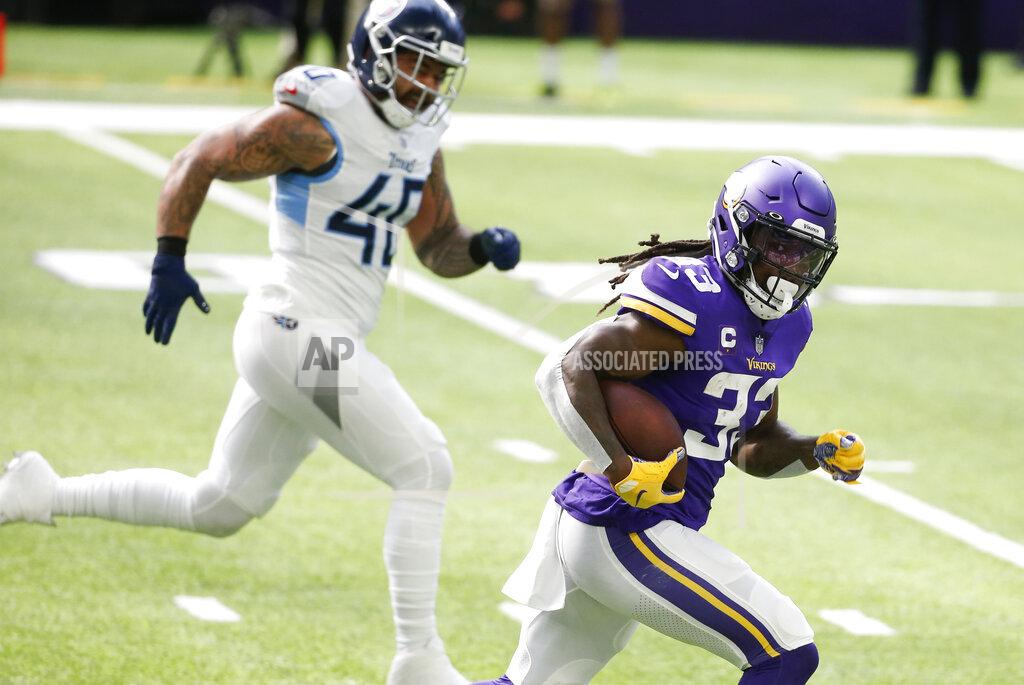 Bruce Kluckhohn Minnesota Vikings running back Dalvin Cook runs from Tennessee Titans outside linebacker Kamalei Correa (40) during a 39-yard touchdown run in the first half of an NFL football game, Sunday, Sept. 27, 2020, in Minneapolis. (AP Photo/Bruce Kluckhohn)