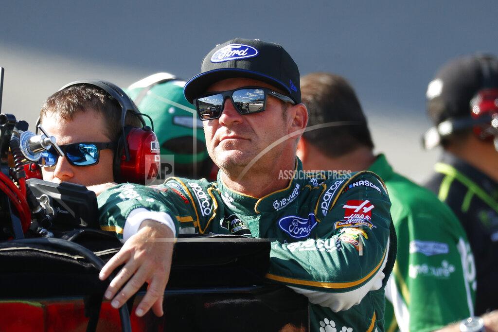 Paul Sancya Clint Bowyer watches qualifying for the NASCAR Cup Series auto race at Michigan International Speedway in Brooklyn, Mich., Friday, Aug. 9, 2019. (AP Photo/Paul Sancya)