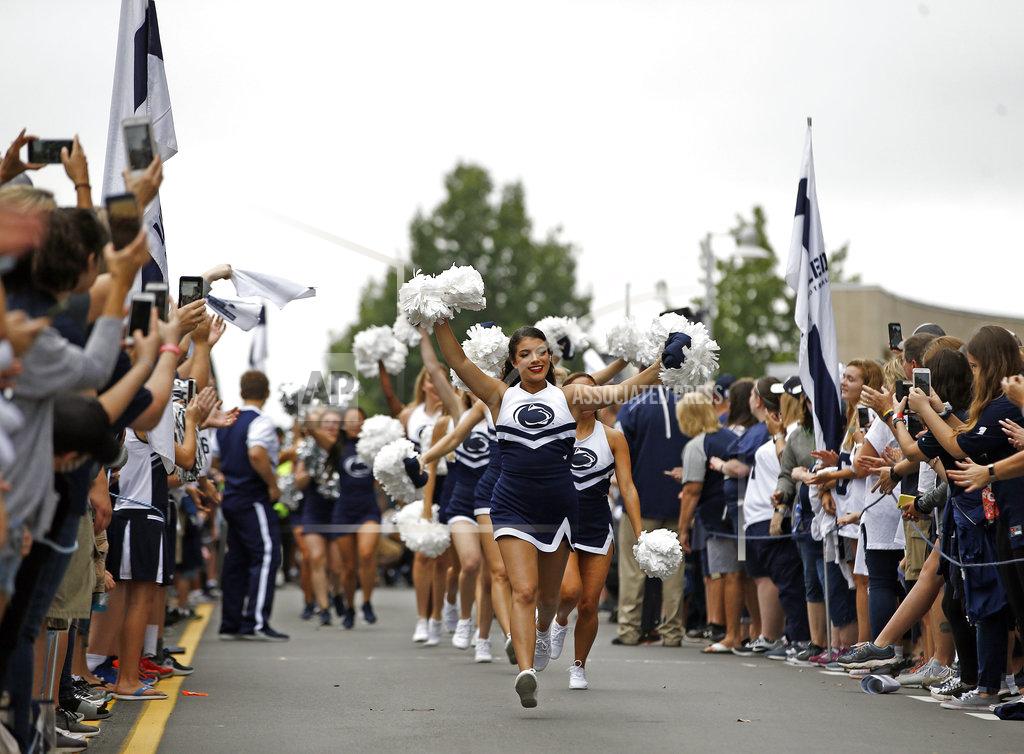 Chris Knight Penn State cheerleaders run out to get fans pumped up before the team arrives to take on Kent State in an NCAA college football game in State College, Pa., Saturday, Sept. 15, 2018. (AP Photo/Chris Knight)