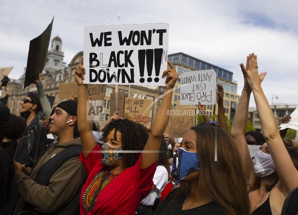 Peter Dejong People take part in a Black Lives Matter protest in Amsterdam, Netherlands, Monday, June 1, 2020, to protest against the recent killing of George Floyd, a black man who died in police custody in Minneapolis, U.S.A., after being restrained by police officers on Memorial Day. (AP Photo/Peter Dejong)