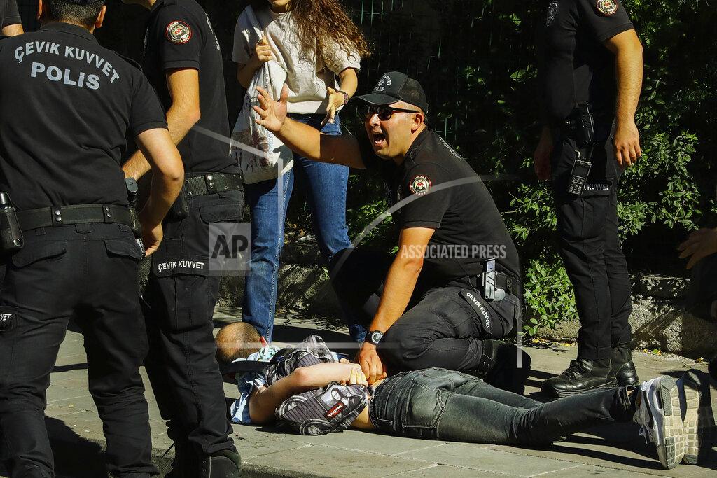 Ali Unal A man is detained during the LGBTQ Pride March in Ankara, Turkey, Tuesday, July 5, 2022. Police in Turkey’s capital have broken up a LGBTQ Pride march and detained dozens of people. Turkish authorities have banned LGBTQ events. (AP Photo/Ali Unal)