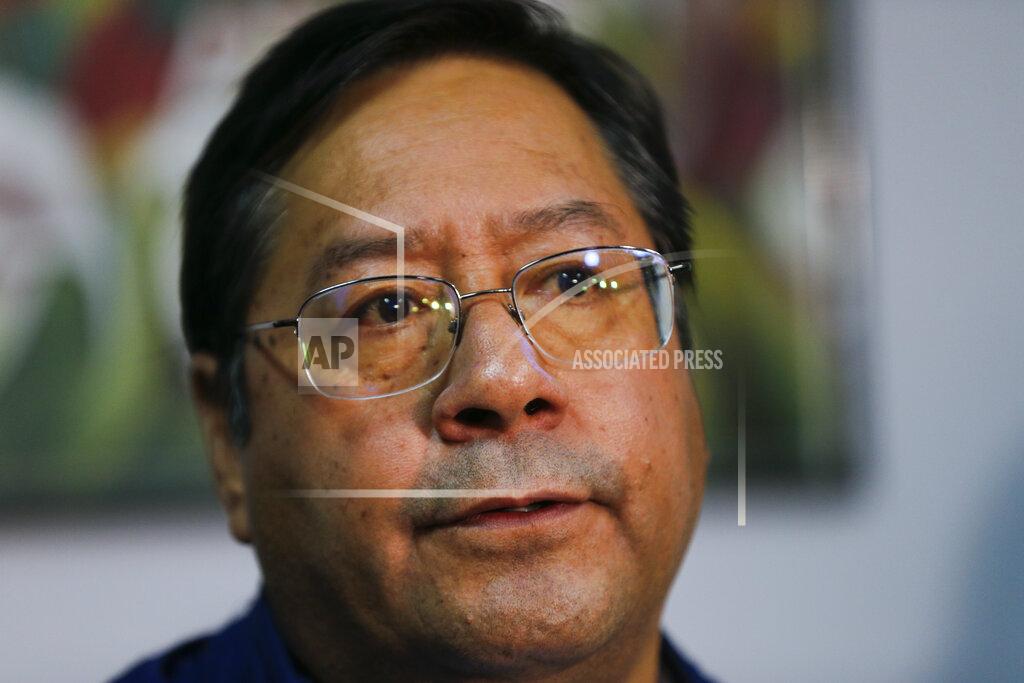 Juan Karita Luis Arce, presidential candidate for the Movement Towards Socialism (MAS) party, talks during a press conference after general elections in La Paz, Bolivia, Monday, Oct. 19, 2020. (AP Photo/Juan Karita)