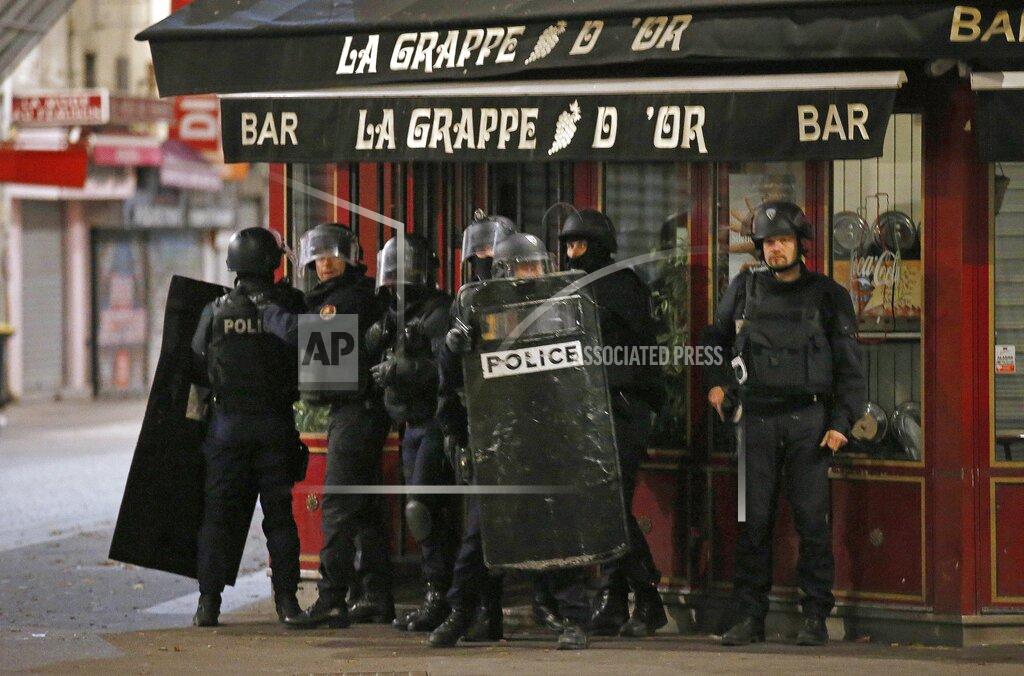Francois Mori FILE - In this Nov. 18, 2015 file photo police officers take up positions in Saint Denis, a northern suburb of Paris, Wednesday, Nov. 18, 2015. (AP Photo/Francois Mori, File)