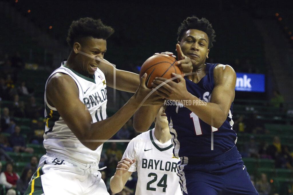 Jerry Larson Baylor forward Flo Thamba (0) and Jackson State forward Jayveous McKinnis (11) battle for the ball in the first half of an NCAA college basketball game, Monday, Dec. 30, 2019, in Waco, Texas. (AP Photo/Jerry Larson)