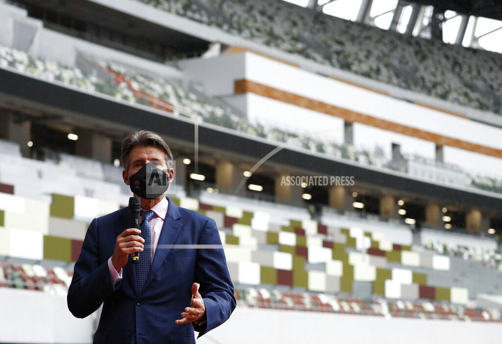 Issei Kato World Athletics President Sebastian Coe wearing a protective face mask speaks to media as he inspects at the National Stadium, the main stadium of Tokyo 2020 Olympics and Paralympics, in Tokyo Thursday, Oct. 8, 2020. (Issei Kato/Pool Photo via AP)
