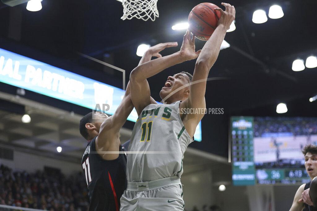 Jed Jacobsohn San Francisco forward Patrick Tape, right, shoots against Gonzaga guard Nolan Hickman, left, during the first half of an NCAA college basketball game in San Francisco, Calif., Thursday, Feb. 24, 2022. (AP Photo/Jed Jacobsohn)