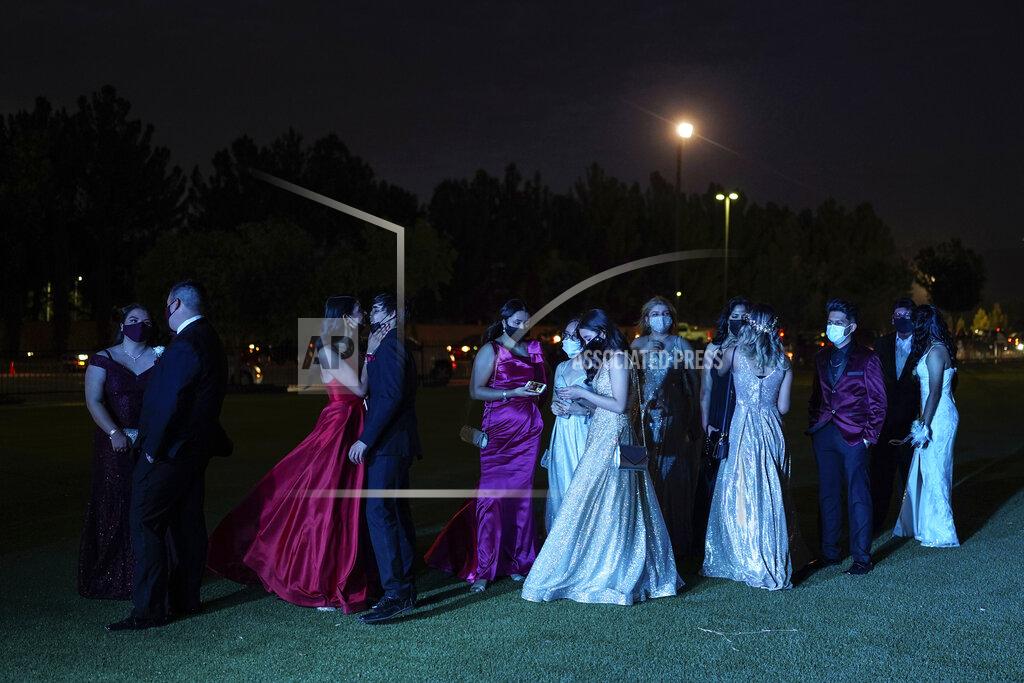 Paul Ratje Young people attend prom at the Grace Gardens Event Center in El Paso, Texas on Friday, May 7, 2021. Around 2,000 attended the outdoor event at the private venue after local school districts announced they would not host proms this year. Tickets cost $45. (AP Photo/Paul Ratje)