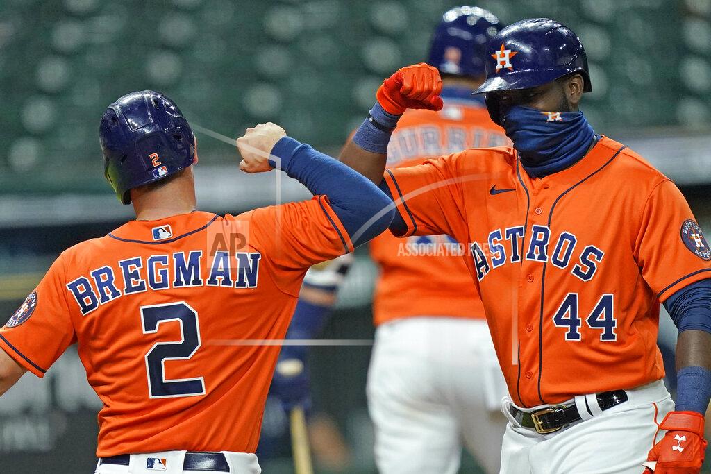 David J. Phillip Houston Astros' Yordan Alvarez (44) celebrates with Alex Bregman (2) after both scored on Alvarez's three-run home run against the Seattle Mariners during the first inning of a baseball game Friday, Aug. 14, 2020, in Houston. (AP Photo/David J. Phillip)