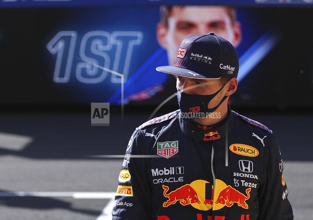 Lars Baron Red Bull driver Max Verstappen of the Netherlands walks after finishing first in the Sprint Qualifying of the British Formula One Grand Prix, at the Silverstone circuit, in Silverstone, England, Saturday, July 17, 2021. The British Formula One Grand Prix will be held on Sunday. (Lars Baron/Pool via AP)