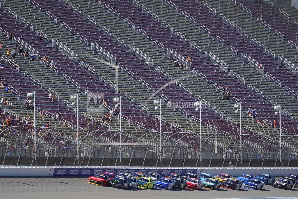 Paul Sancya Ty Gibbs (54) leads the field into a restart during the New Holland 250 NASCAR Xfinity Series auto race at the Michigan International Speedway in Brooklyn, Mich., Saturday, Aug. 6, 2022. (AP Photo/Paul Sancya)