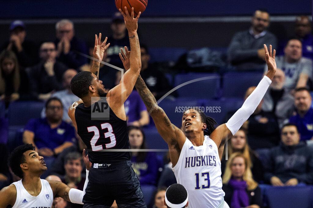 Andy Bao Washington forward Hameir Wright (13) attempts to block a shot by Seattle guard Terrell Brown (23) during the first half of an NCAA college basketball game, Tuesday, Dec. 17, 2019, in Seattle. (Andy Bao/The Seattle Times via AP)