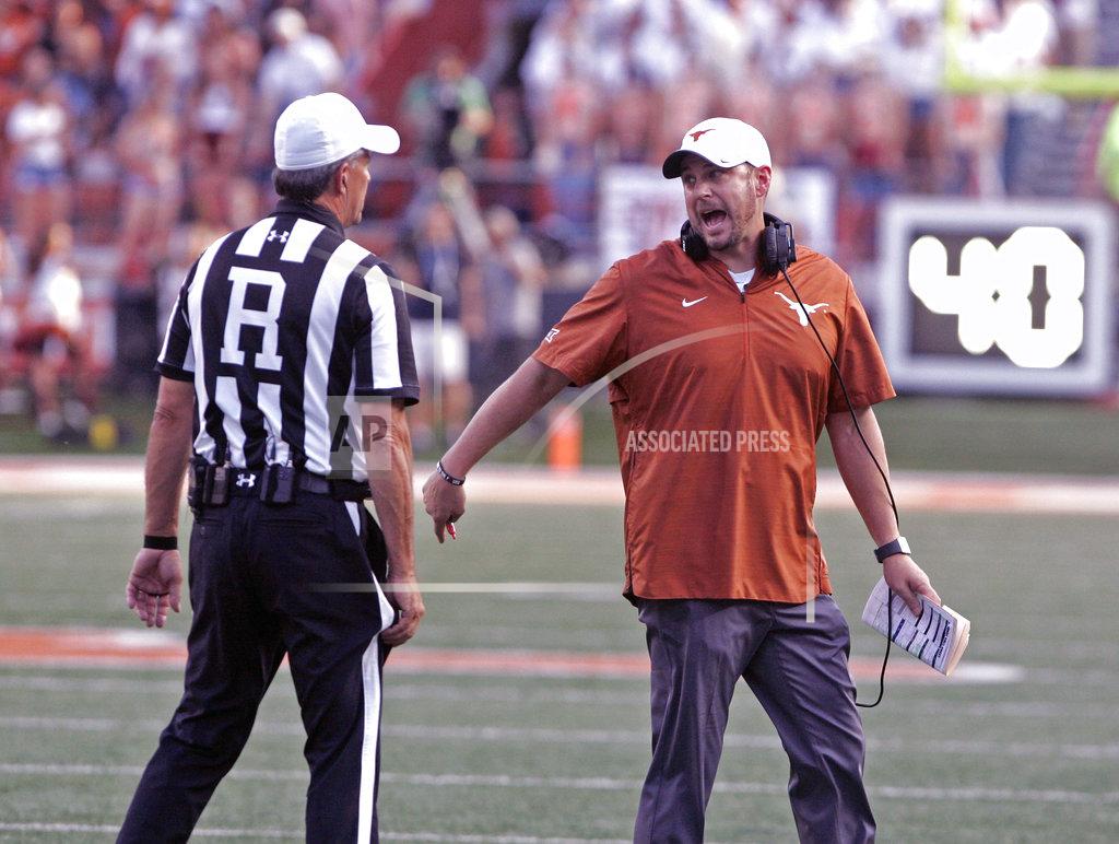 Michael Thomas Texas head coach Tom Herman talks with the referee during the second half of an NCAA college football game against West Virginia, Saturday, Nov. 3, 2018, in Austin, Texas. West Virginia won 42-41. (AP Photo/Michael Thomas)