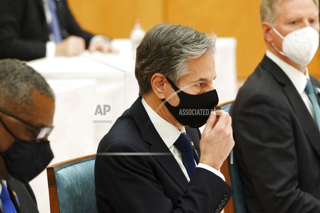 Eugene Hoshiko U.S. Secretary of State Antony Blinken, center, and Defense Secretary Lloyd Austin, left, meet with Japanese Prime Minister Yoshihide Suga, not in picture, during a courtesy call at the prime minister's official residence in Tokyo Tuesday, March 16, 2021. (AP Photo/Eugene Hoshiko, Pool)