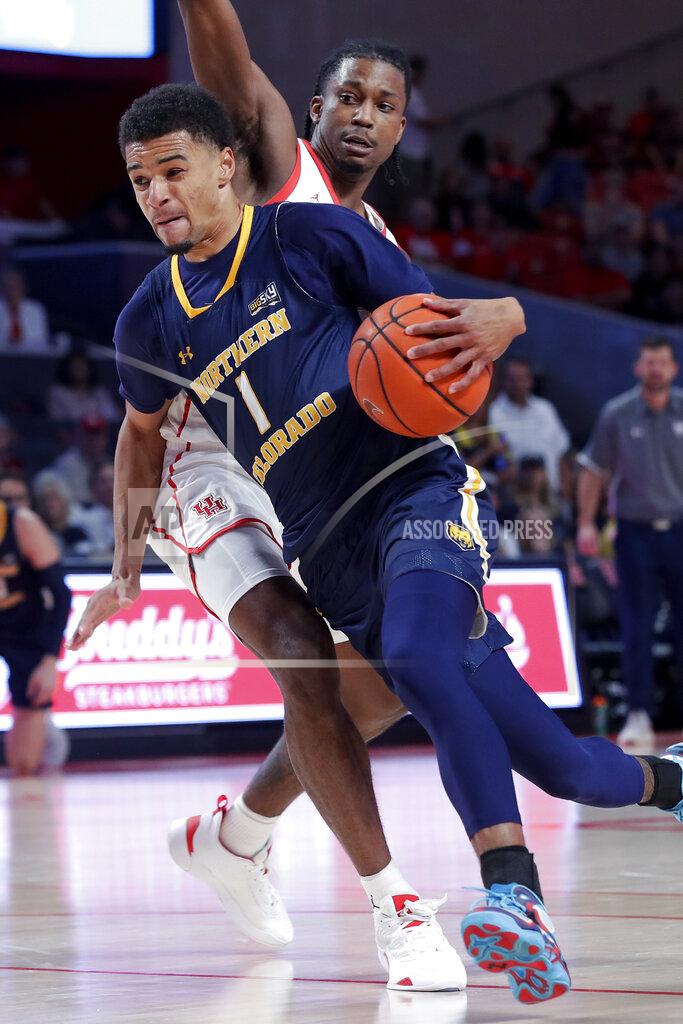 Michael Wyke Northern Colorado guard Daylen Kountz (1) drives around Houston guard Tramon Mark, right, during the first half of an NCAA college basketball game Monday, Nov. 7, 2022, in Houston. (AP Photo/Michael Wyke)