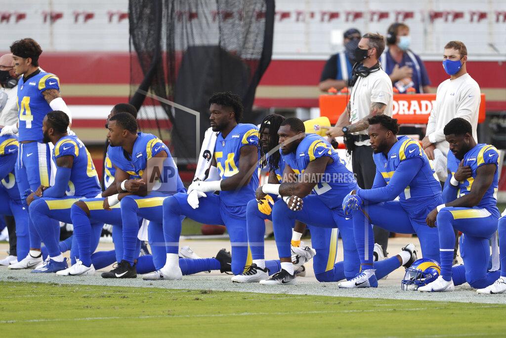 Jed Jacobsohn Los Angeles Rams players kneel during the national anthem before an NFL football game against the San Francisco 49ers in Santa Clara, Calif., Sunday, Oct. 18, 2020. (AP Photo/Jed Jacobsohn)