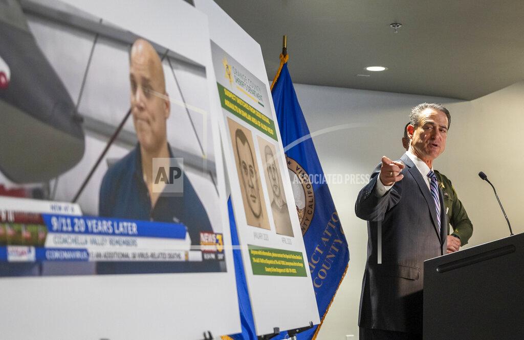 Leonard Ortiz Orange County District Attorney Todd Spitzer points to a photo of Robert Daniel Yucas, 51, who was arrested connection with sexual assaults on at least three women on the Aliso Creek Trail during a joint press conference with Orange County Sheriff Don Barnes in Santa Ana on Monday, Sept. 20, 2021. Sheriff's investigators were able to connect Yucas to the crime through a DNA match. (Leonard Ortiz/The Orange County Register via AP)