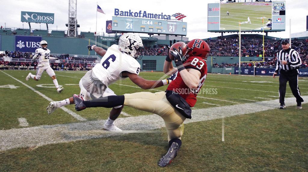 Charles Krupa Harvard wide receiver Jack Cook (83) is forced out-of-bounds by Yale defensive back Jaelin Alburg (6) for an incomplete pass during the second half of an NCAA college football game at Fenway Park in Boston, Saturday, Nov. 17, 2018. (AP Photo/Charles Krupa)