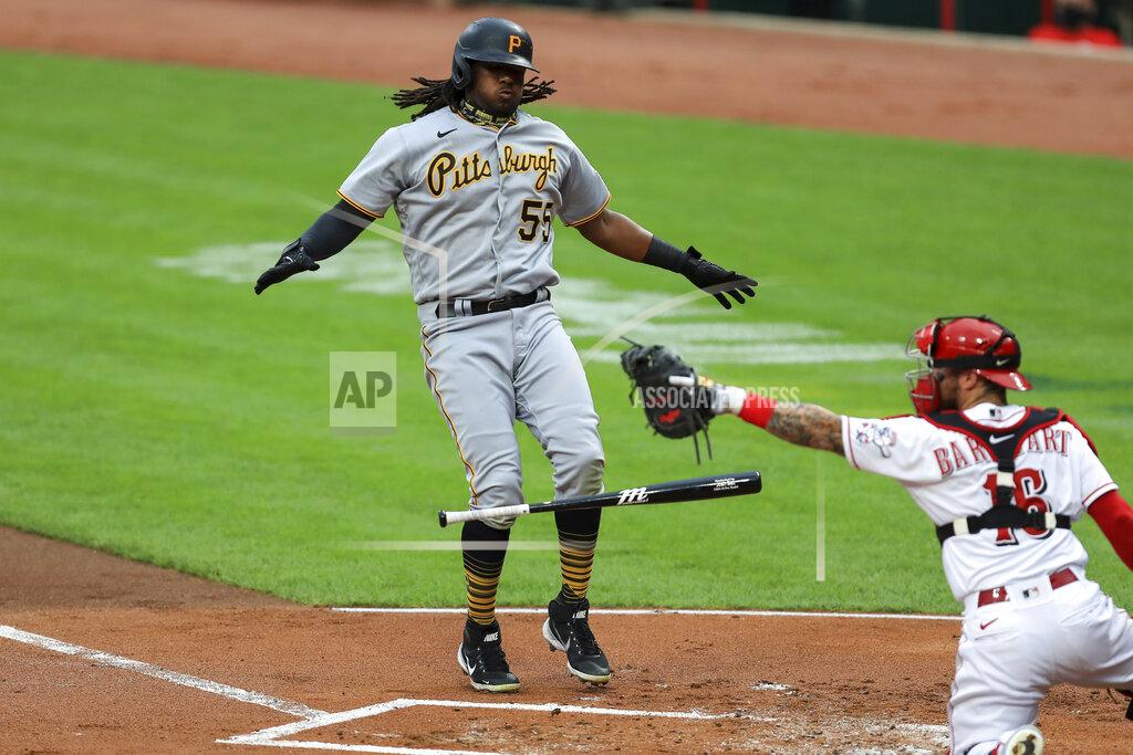 Aaron Doster Pittsburgh Pirates' Josh Bell (55) reacts to drawing a walk as Cincinnati Reds' Tucker Barnhart (16) reacts in the first inning during a baseball game at in Cincinnati, Friday, Aug. 14, 2020. (AP Photo/Aaron Doster)