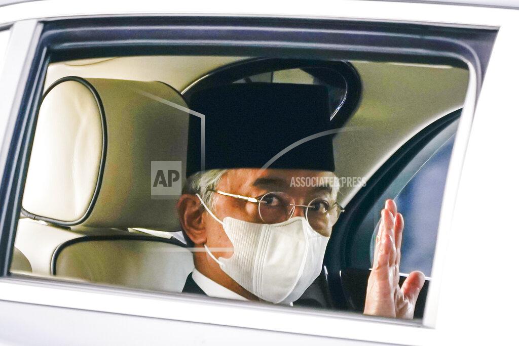 Vincent Thian Malaysia's King Sultan Abdullah Sultan Ahmad Shah waves as he leaves National Palace in Kuala Lumpur, Malaysia, Sunday, Oct. 25, 2020. National Palace statement says Malay rulers has decided not to accede to Prime Minister Muhyiddin Yassin's request to declare a state of emergency. (AP Photo/Vincent Thian)