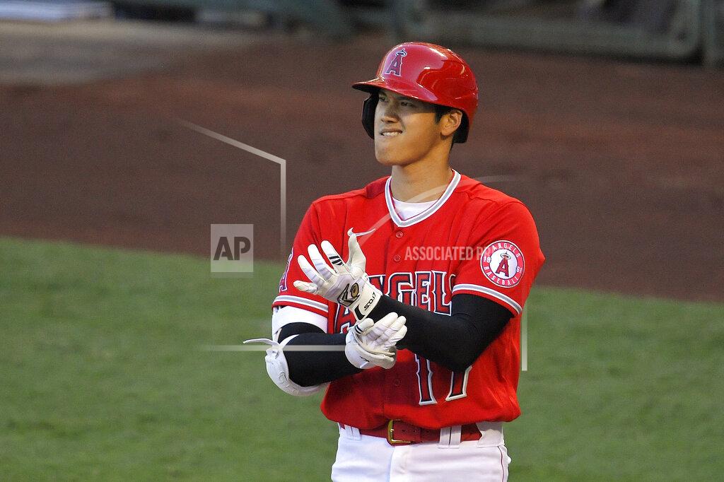Mark J. Terrill Los Angeles Angels' Shohei Ohtani adjusts his gloves during an at-bat din the first inning of a baseball game against the Houston Astros Friday, July 31, 2020, in Anaheim, Calif. (AP Photo/Mark J. Terrill)