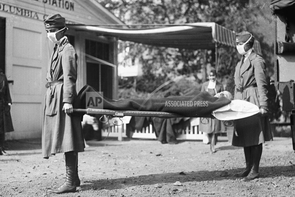Library Of Congress FILE - This photo made available by the Library of Congress shows a demonstration at the Red Cross Emergency Ambulance Station in Washington during the influenza pandemic of 1918. Historians think the pandemic started in Kansas in early 1918, and by winter 1919 the virus had infected a third of the global population and killed at least 50 million people, including 675,000 Americans. Some estimates put the toll as high as 100 million. (Library of Congress via AP, File)